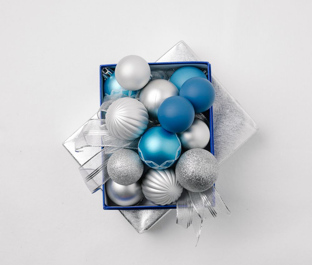 Navy blue and silver baubles arranged together