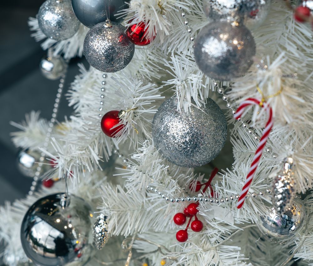 White flocked tree with silver baubles